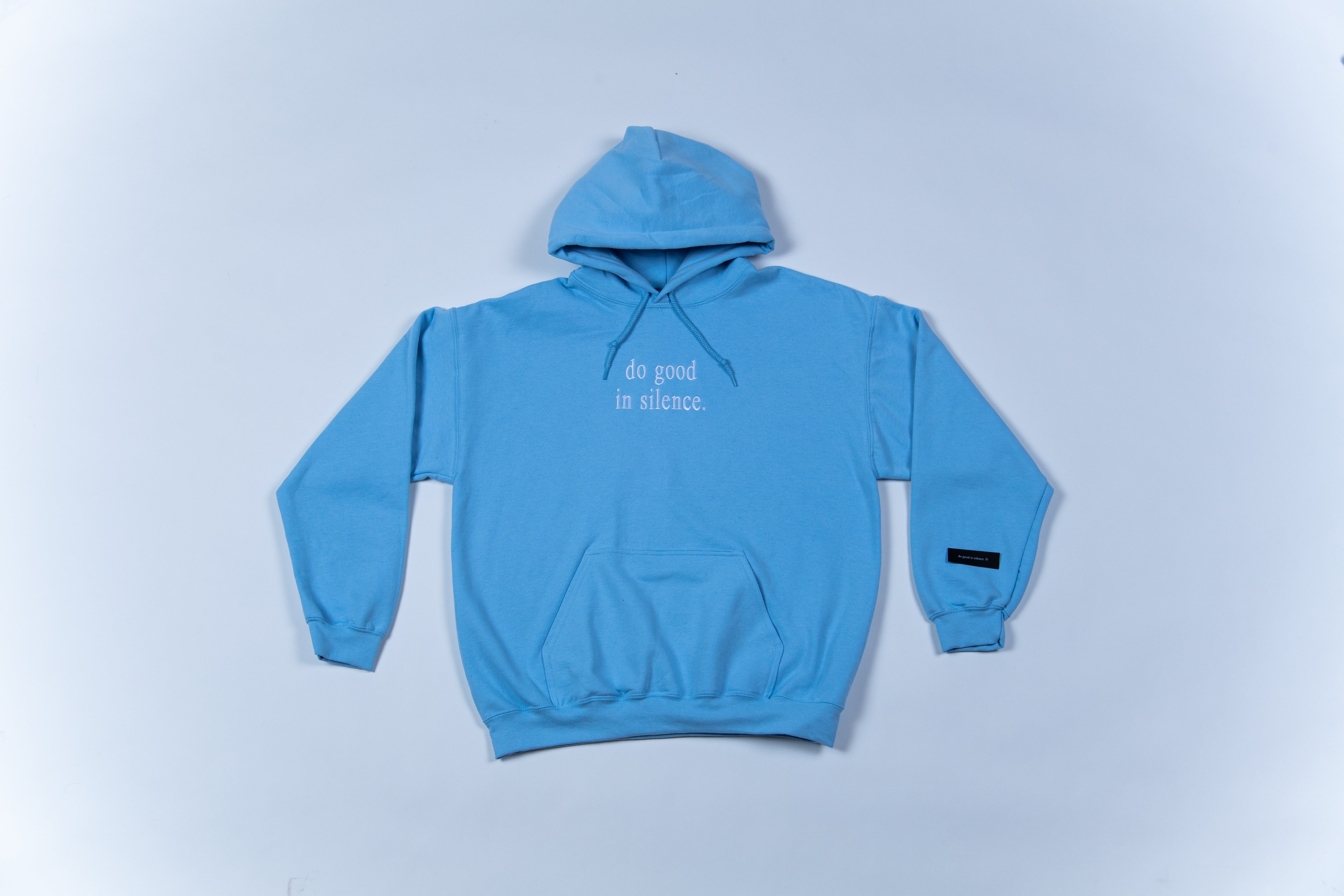 Do good in silence.® baby blue hoodie