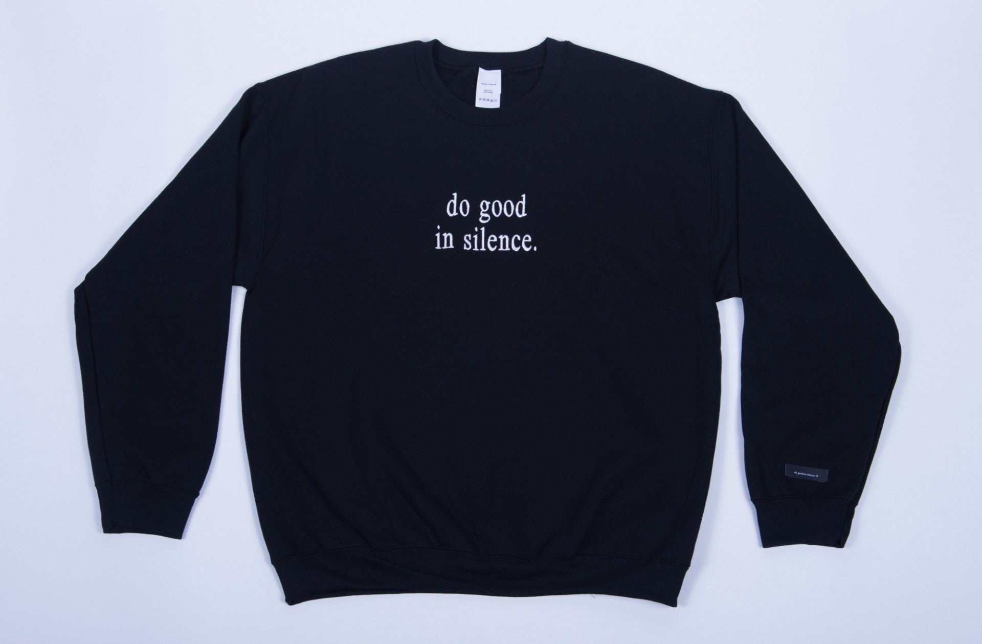 do good in silence.® black crewneck